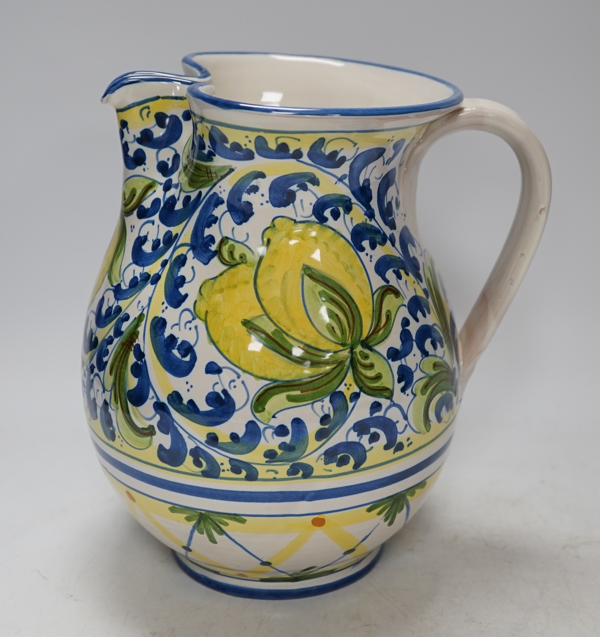 From the Studio of Fred Cuming. An Italian maiolica ‘lemons’ jug, 20cm high. Condition - good